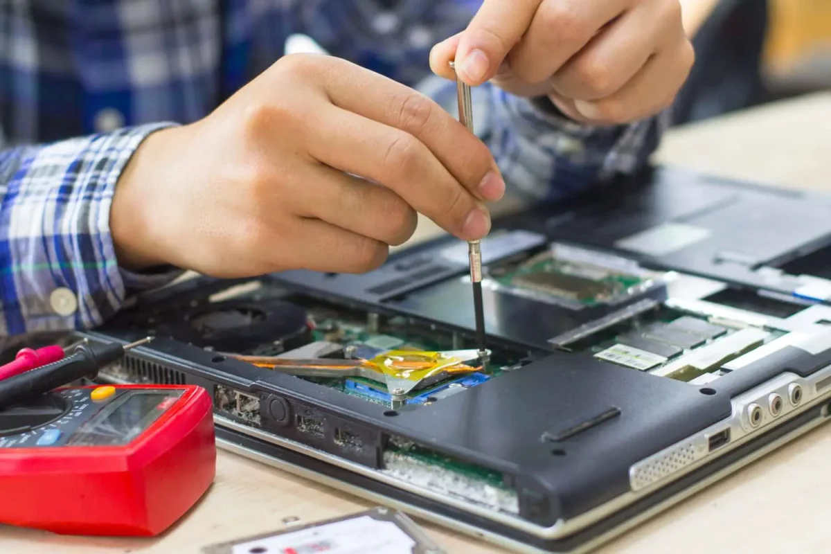 Certified technician performing component-level Business Laptop Repair Dubai